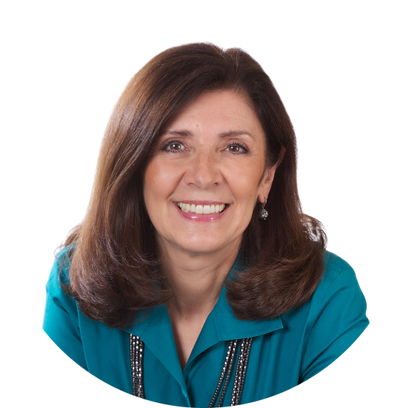 Portrait of Hiring By Design President, Tricia Neves, wearing a teal shirt and smiling at the camera. Portrait of Hiring By Design President, Tricia Neves, wearing a teal shirt and smiling at the camera.